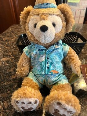Plush Teddy Bear in Light Brown with Blue Hawaiian Outfit